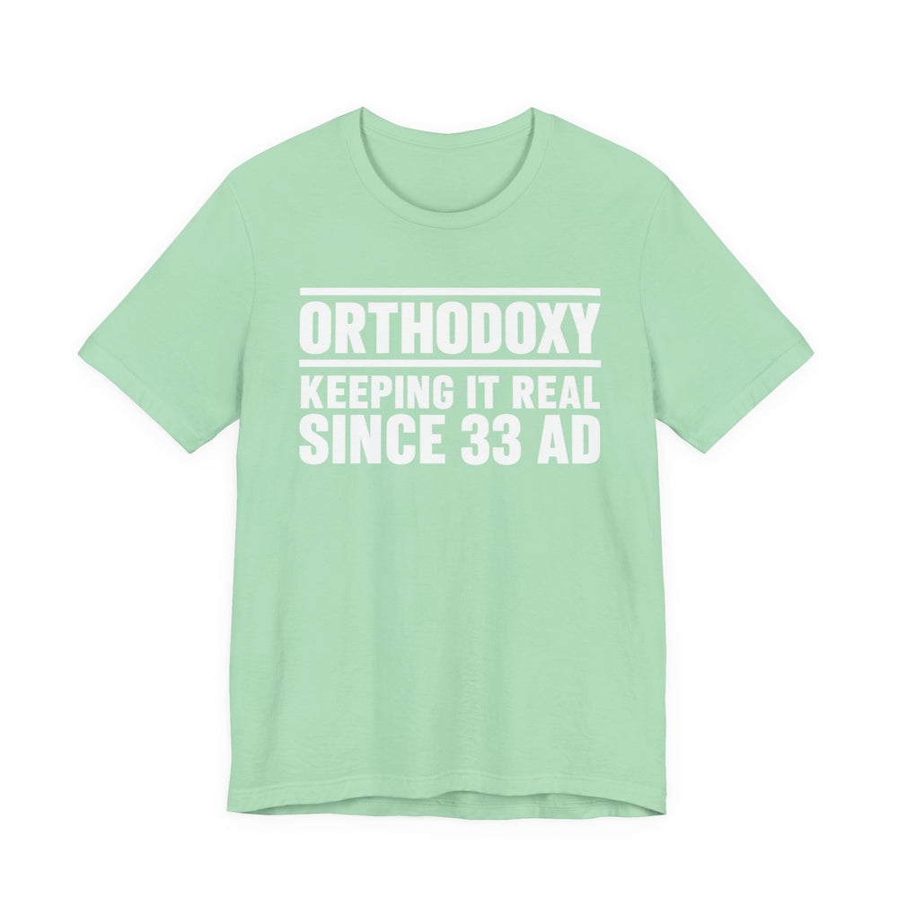 Orthodoxy Keeping It Real Since 33 AD shirt in Mint by Peckwear