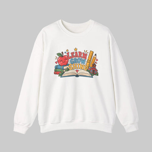 Learn Grow Shine sweatshirt with apple, books and schoolhouse graphic