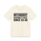 Orthodoxy Keeping It Real Since 33 AD shirt in Natural by Peckwear