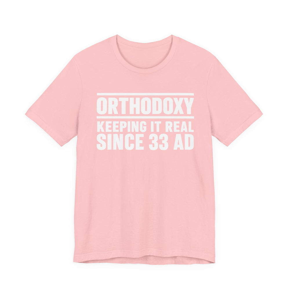 Orthodoxy Keeping It Real Since 33 AD shirt in Pink by Peckwear