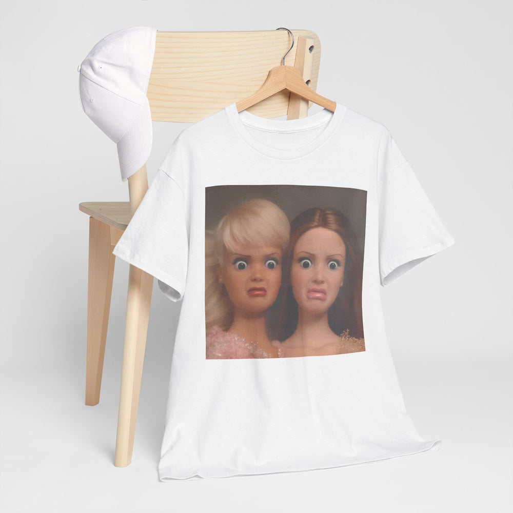White t-shirt with a graphic of two dolls on a wooden chair against a white background