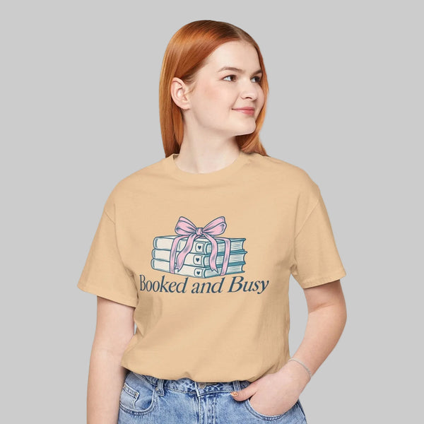 Booked and Busy teacher shirt with stack of books tied in a bow