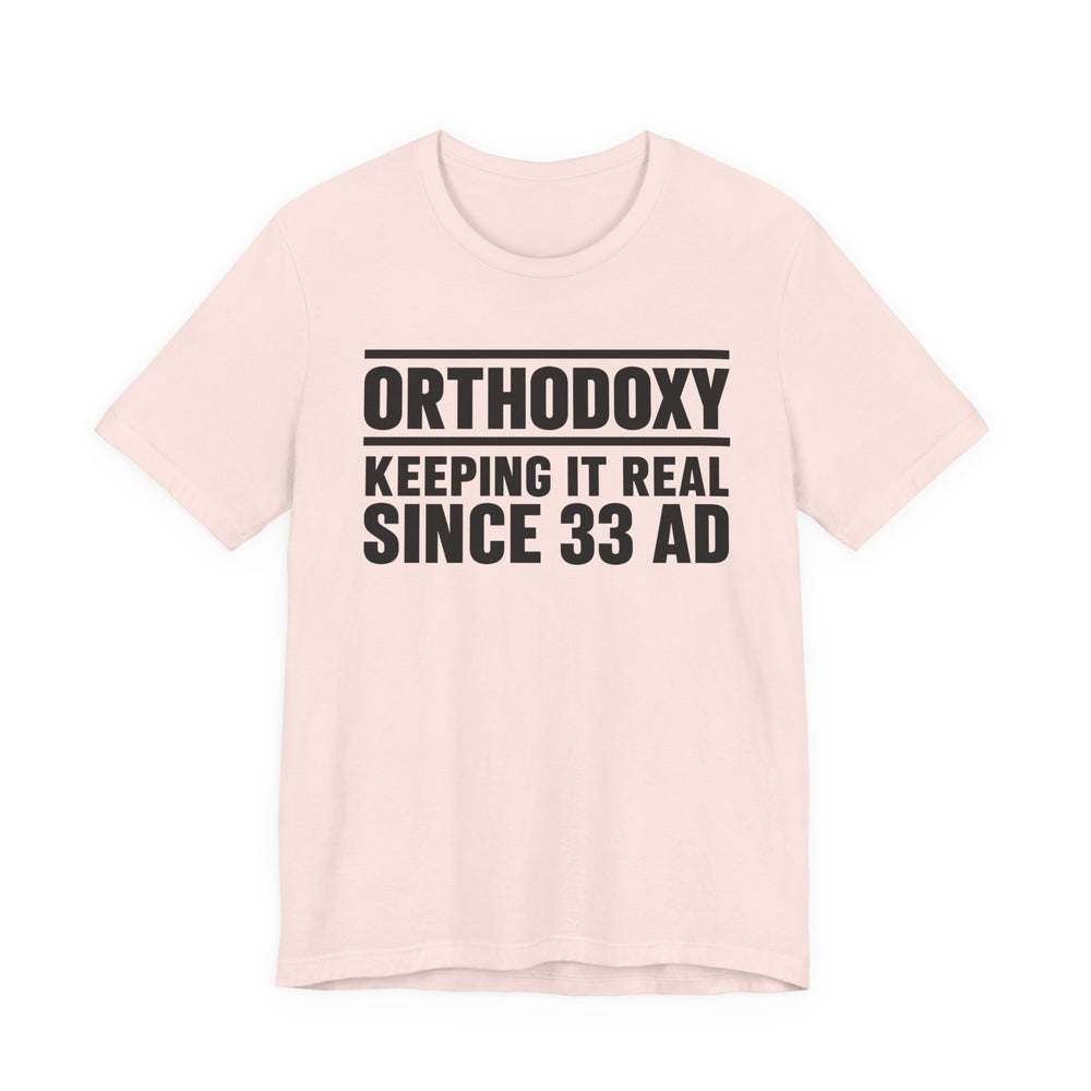 Orthodoxy Keeping It Real Since 33 AD shirt in Soft Pink by Peckwear