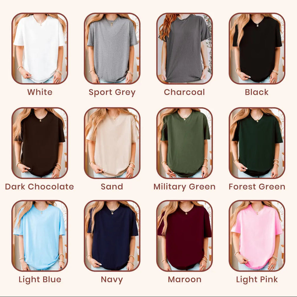 A color-options chart for a women's short-sleeve V-neck T-shirt under the brand name Gildan. The chart shows twelve different shirt color variants, each displayed on a model cropped from the neck down, with labels including White, Sport Grey, Charcoal, Black, Dark Chocolate, Sand, Military Green, Forest Green, Light Blue, Navy, Maroon, and Light Pink.