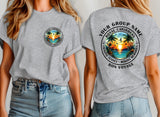 A woman modeling a heather gray t-shirt, showing both the front and back views. The front features a small circular 'Royal Caribbean' logo on the left chest.